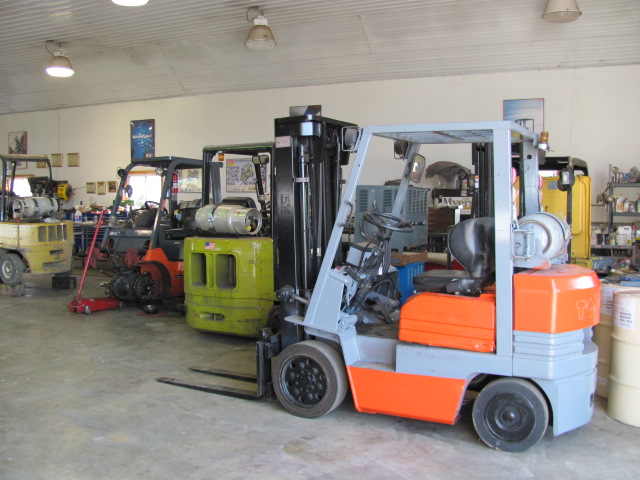 Picture of Completed Repairs on Forklift with Other machines in process of repair